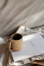 ceramic mug and tea infuser