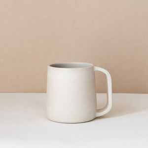 White ceramic tea mug
